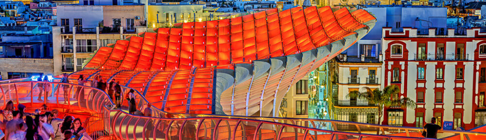 Rooftops of Seville with the Cathedral iluminated