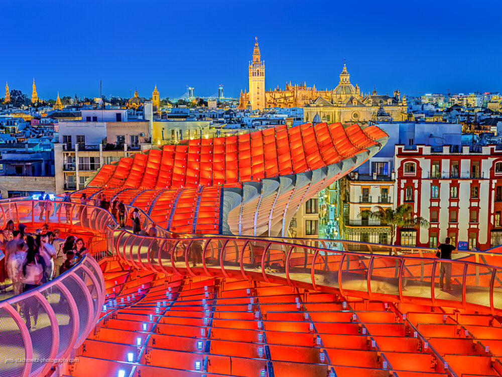 Rooftops of Seville with the Cathedral iluminated
